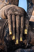 Thailand, Old Sukhothai - Wat Mahathat, detail of the Buddha statue of the bot. 